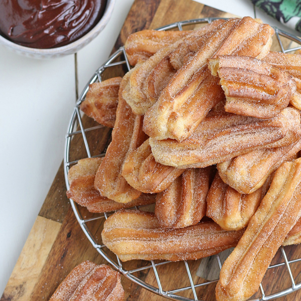 overhead of churros on a wire rack