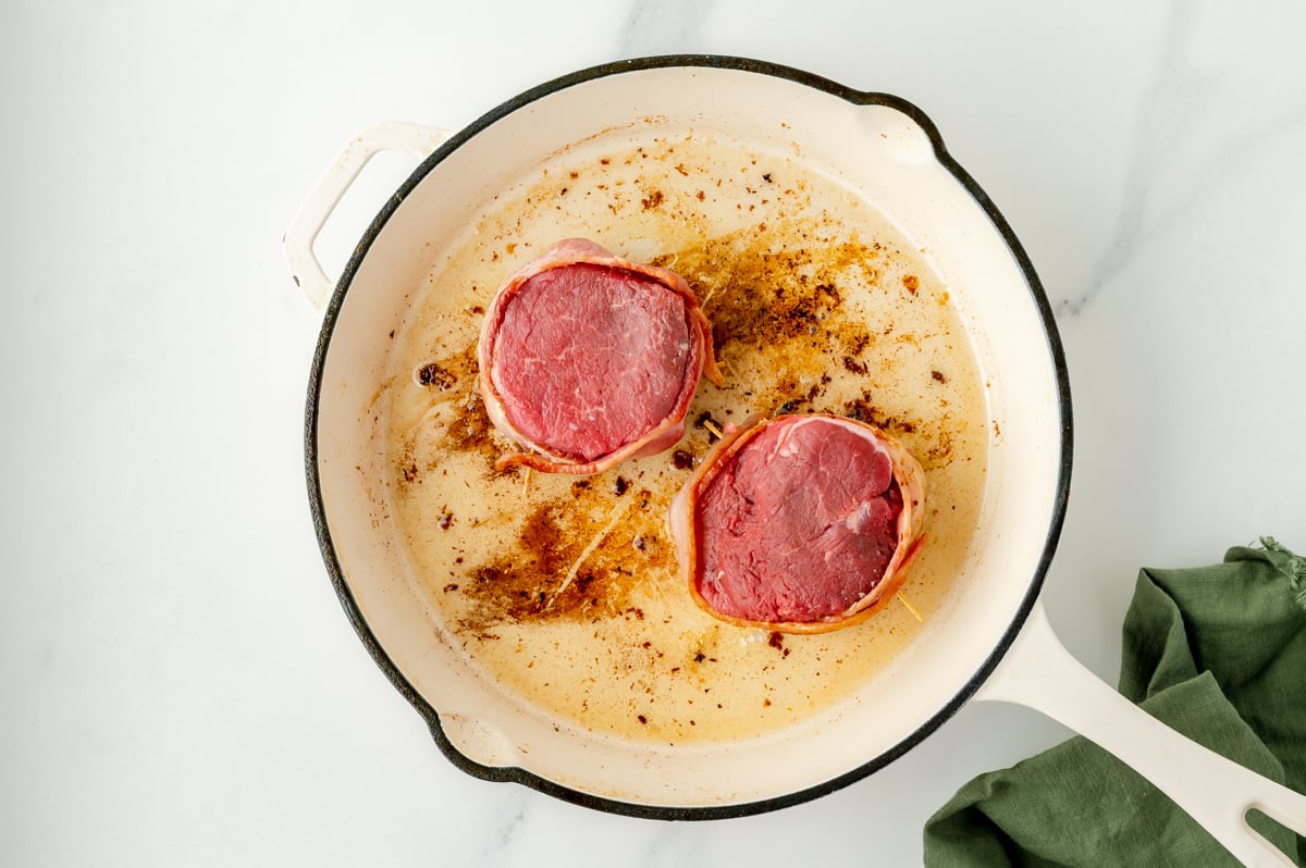 overhead shot of two raw filets in pan