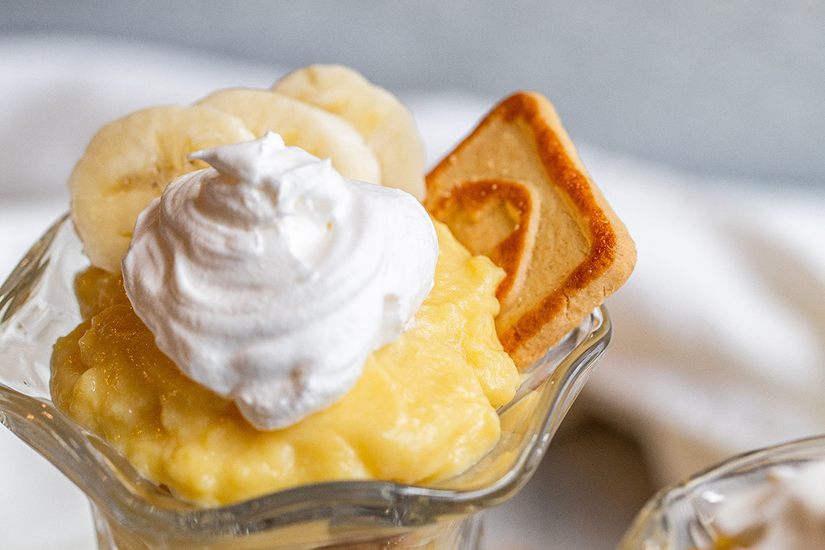 close up shot of whipped cream on pudding cup