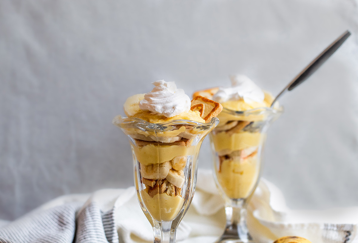 straight on shot of two banana pudding cups