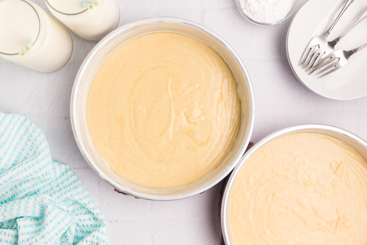 cake batter in two circular pans