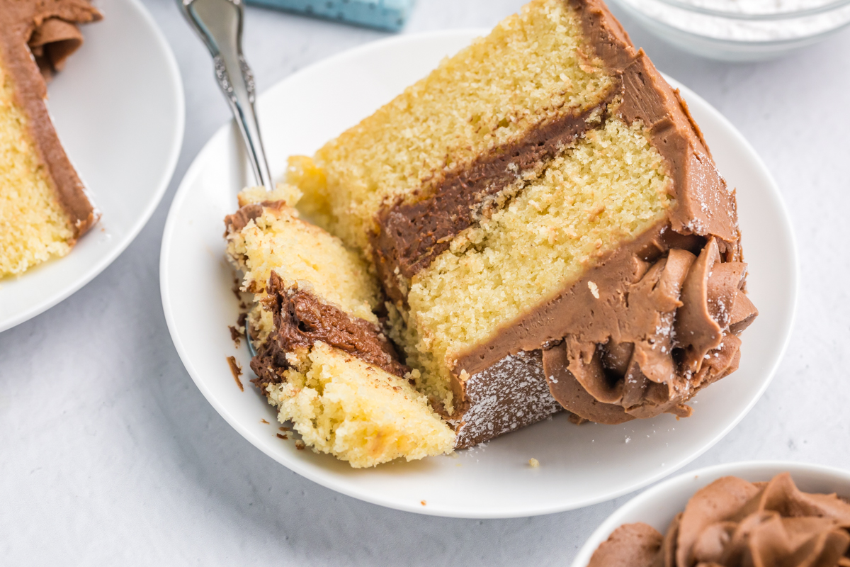 bite taken out of slice of brown butter cake on plate