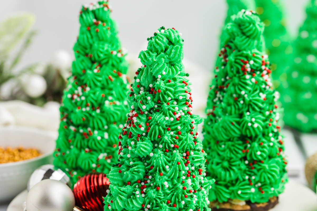 christmas tree cupcakes topped with red, green and white sprinkles