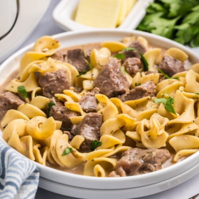 angled shot of plate of crock pot beef and noodles