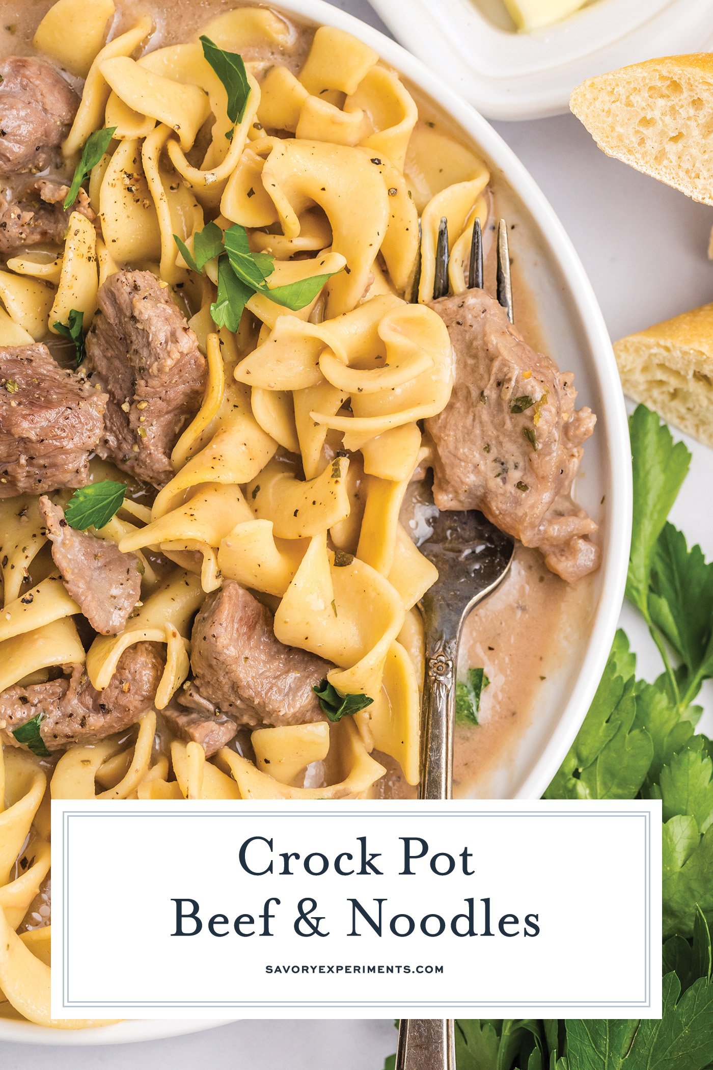 overhead shot of fork on plate of crock pot beef and noodles with text overlay