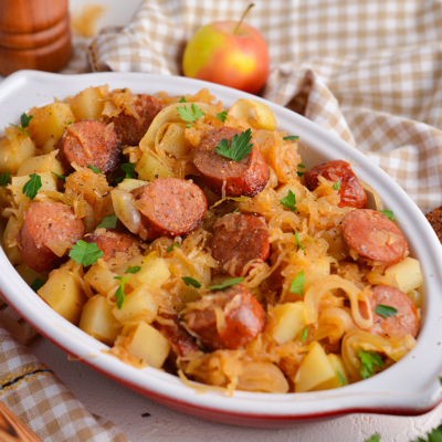 angled shot of crock pot sauerkraut and sausage