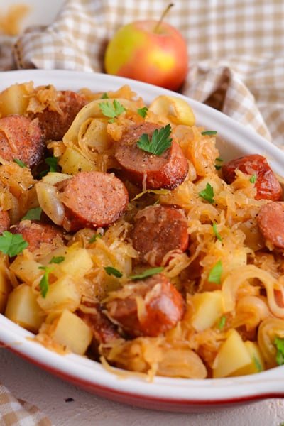 angled shot of crock pot sauerkraut and sausage