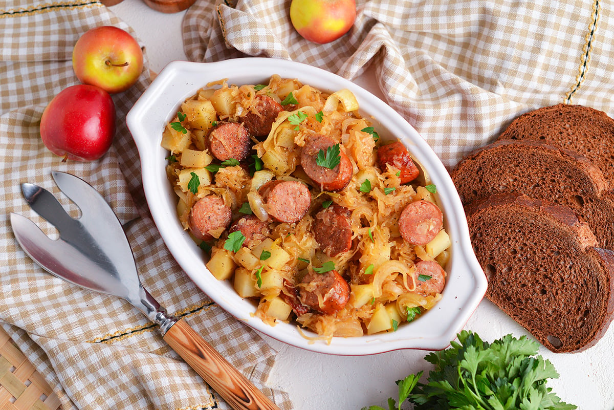 overhead shot of slow cooker sauerkraut and sausage in a dish