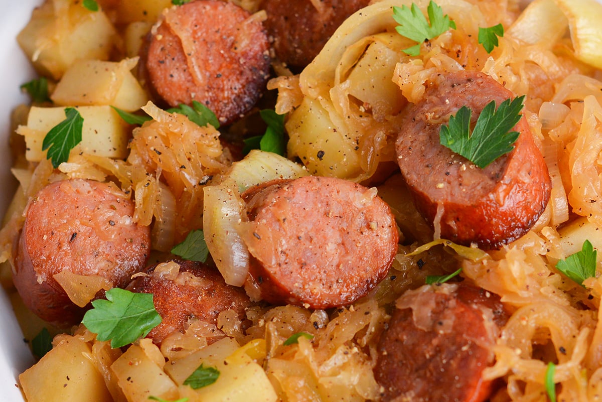 close up shot of slow cooker sauerkraut and sausage