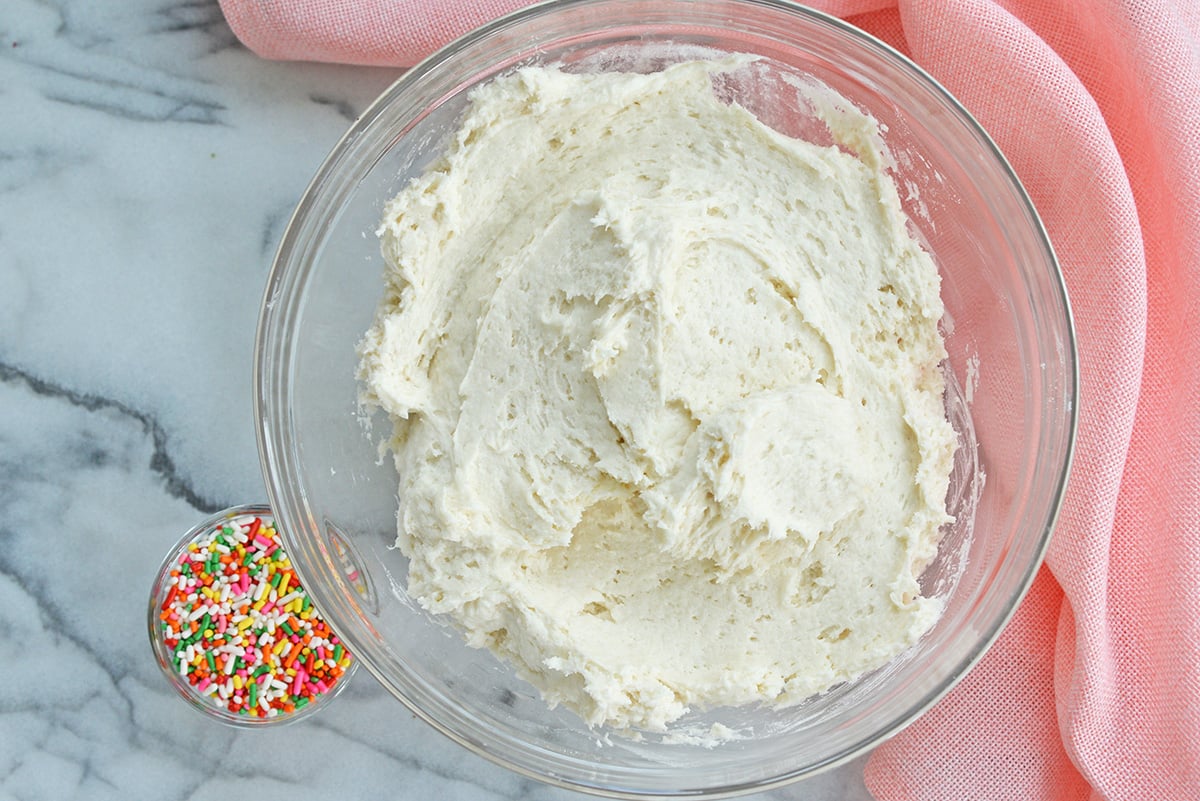 white funfetti dip and bowl of sprinkles