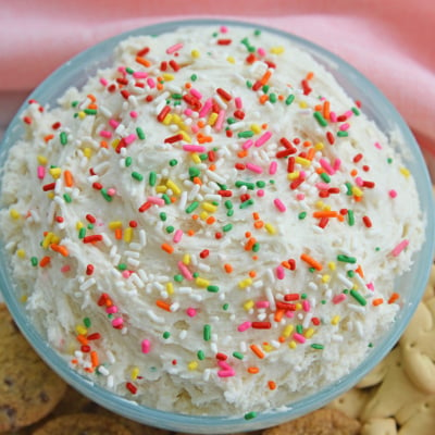 close up angled shot of bowl of funfetti cake batter dip