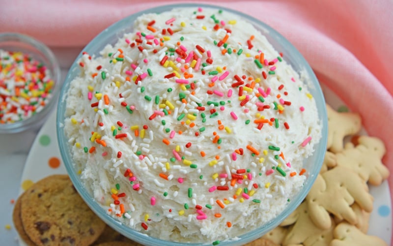 close up angled shot of bowl of funfetti cake batter dip