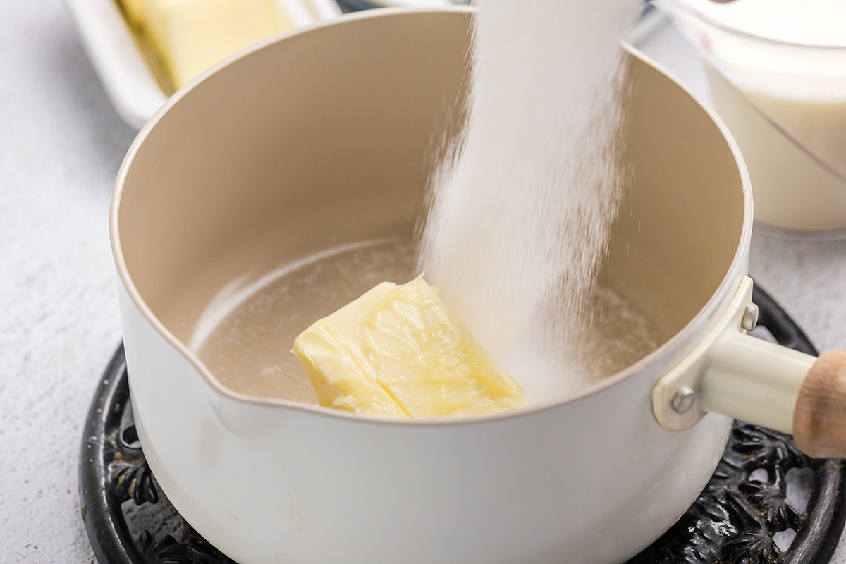 sugar poured into pot with butter