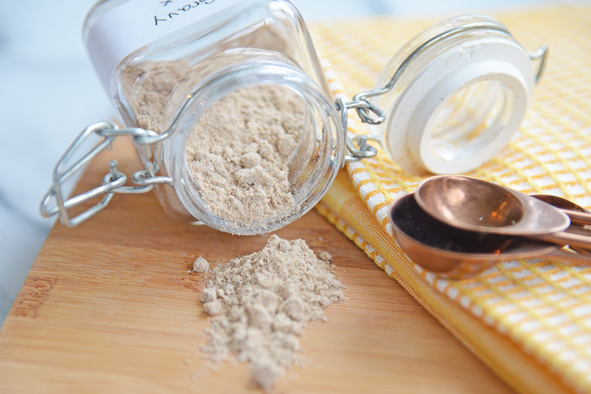 jar of dry gravy mix spilling onto cutting board