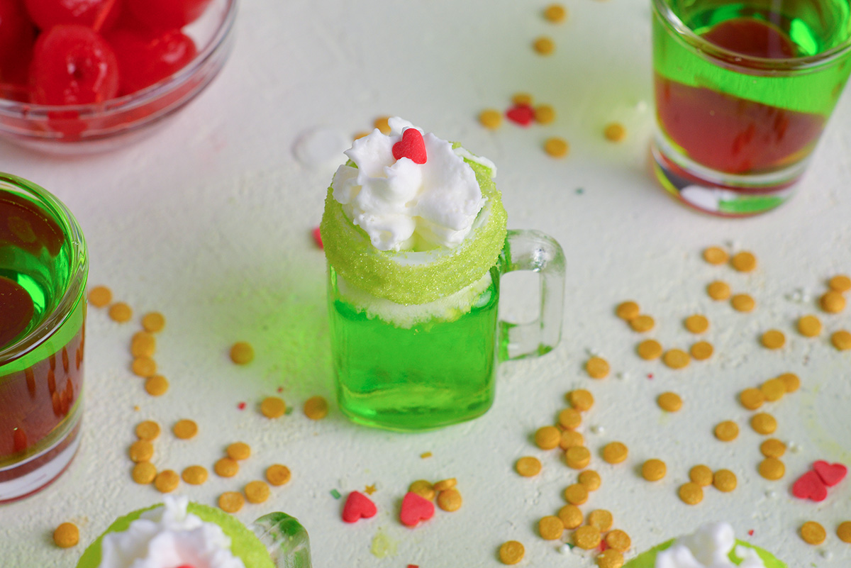 overhead angled shot of christmas shot topped with whipped cream