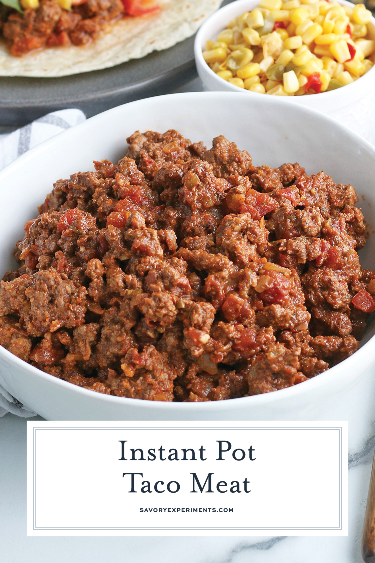 angled shot of bowl of instant pot taco meat with text overlay