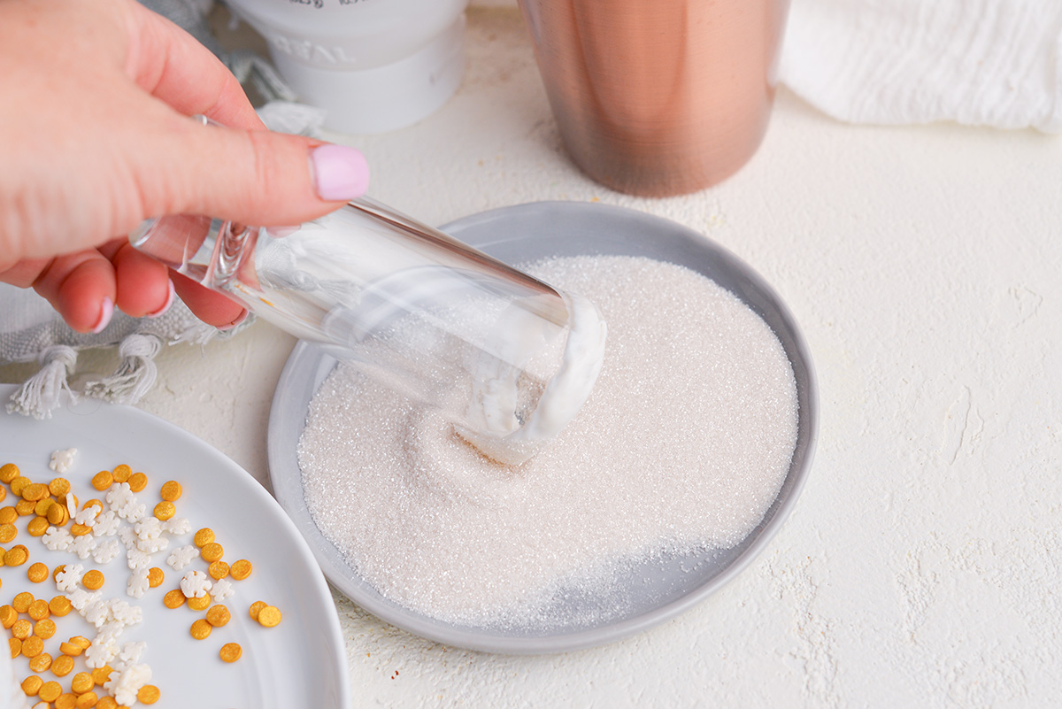 shot glass dipping into sprinkles