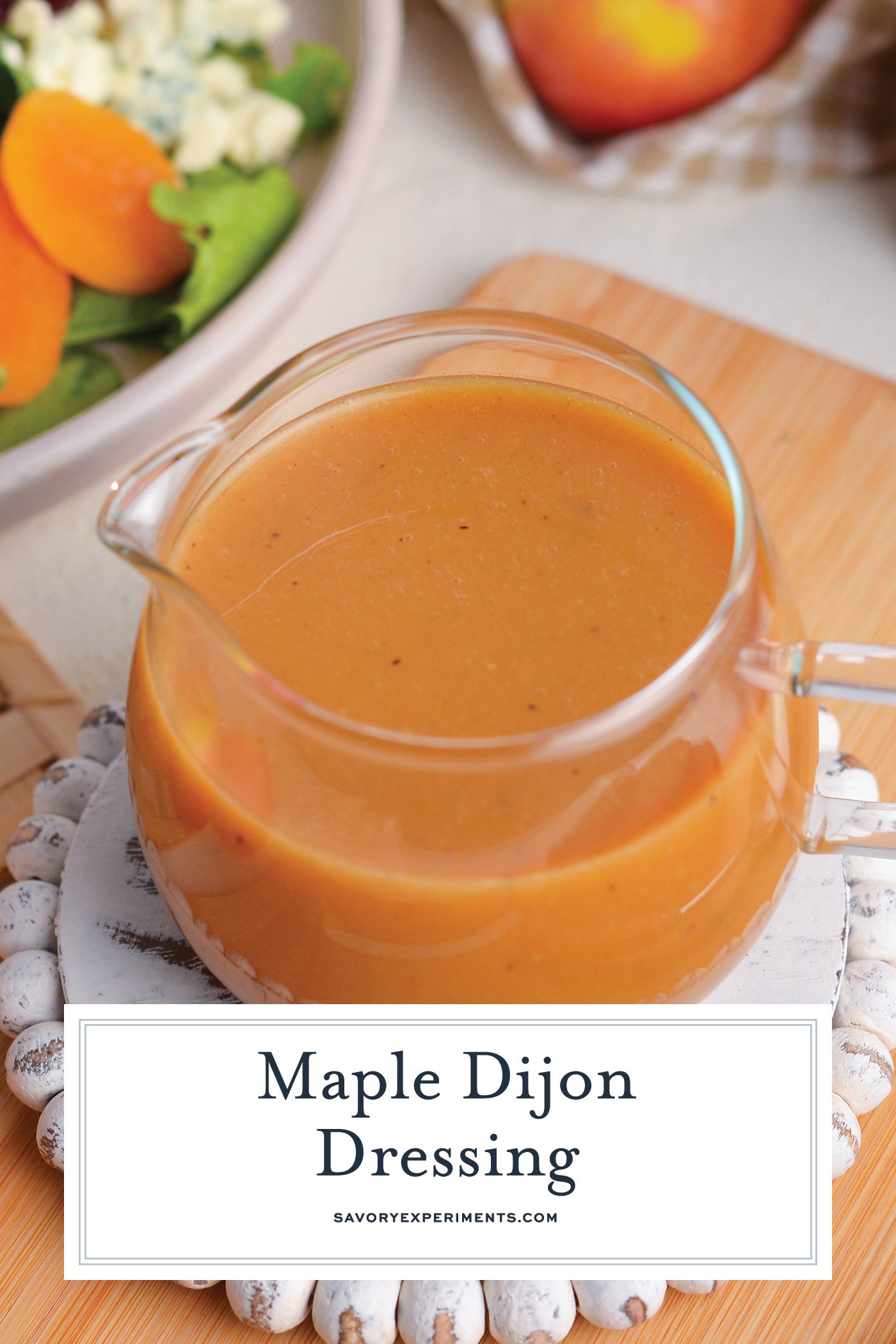 angled shot of maple dijon dressing with text overlay