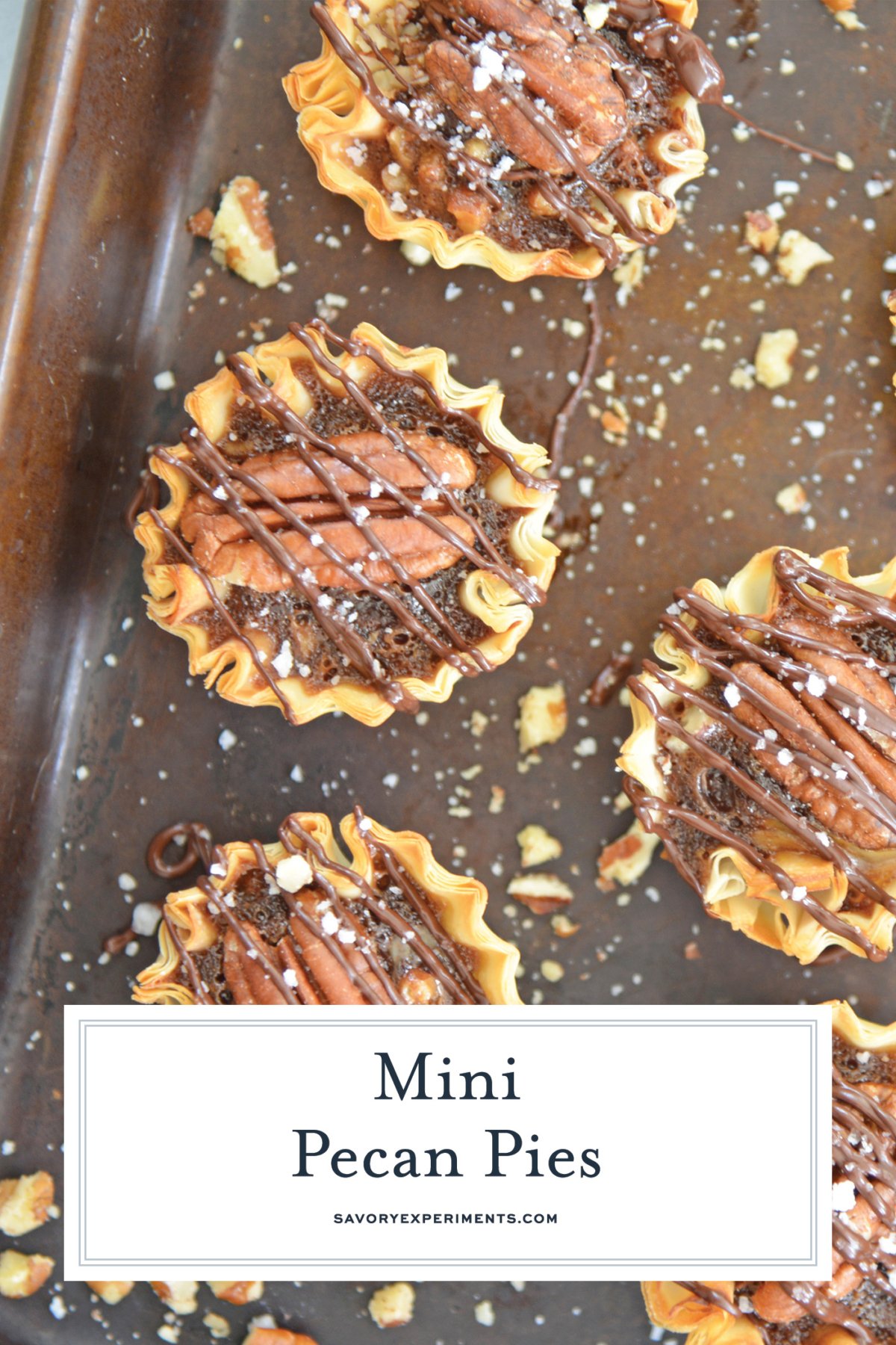 overhead shot of min pies on baking sheet with text overlay