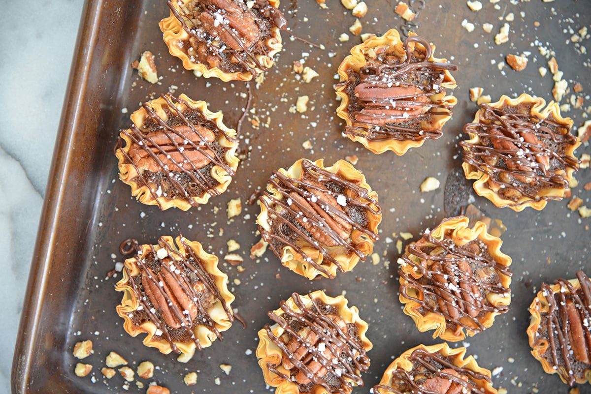 baking sheet with mini pecan pies