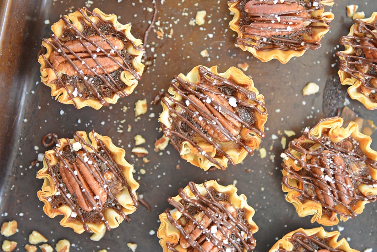 overhead shot of mini pies on baking sheet