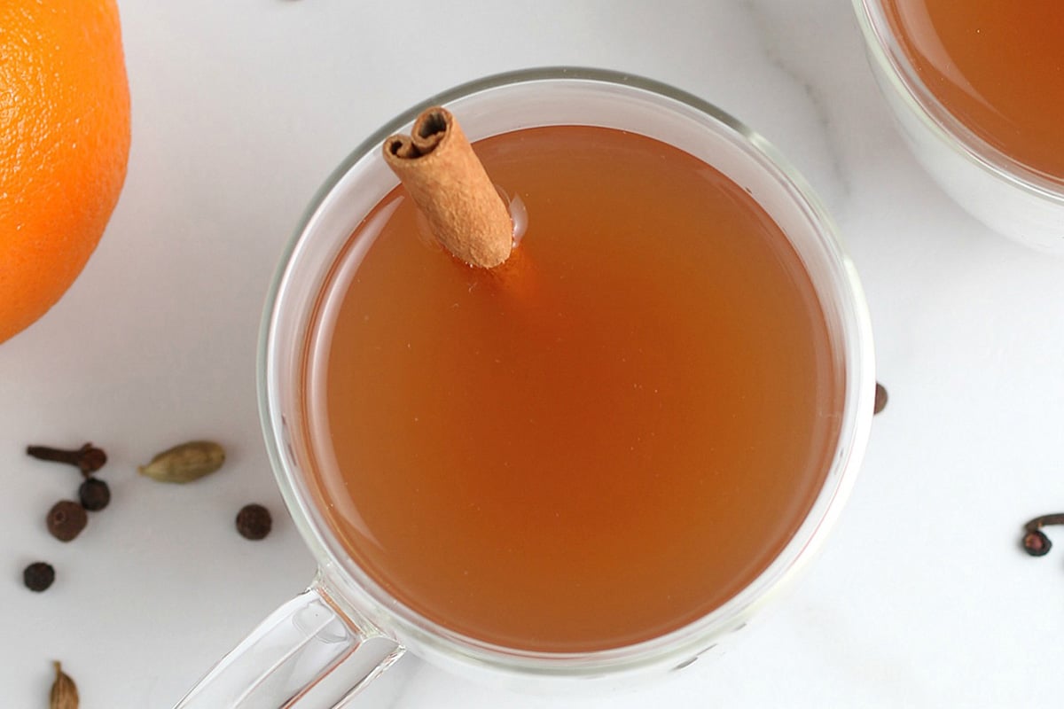 close up overhead shot of hot apple cider in mug