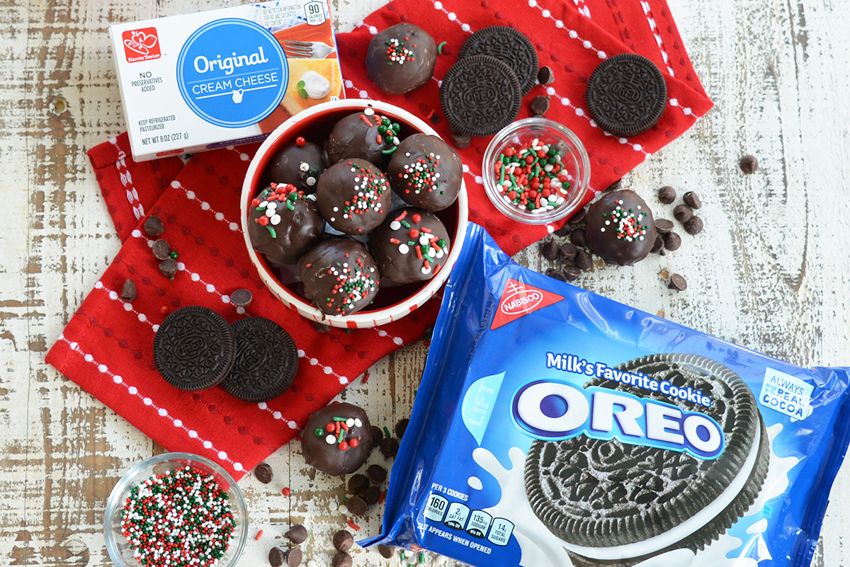 overhead shot of bowl of oreo cookie balls with oreos and cream cheese