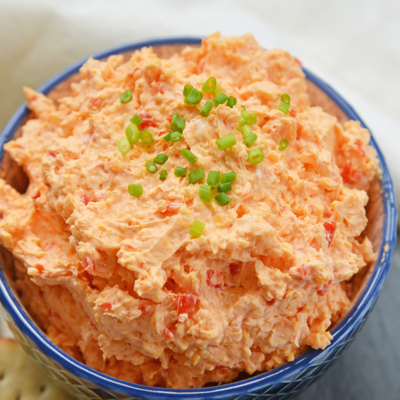 angled shot of bowl of pimento cheese spread