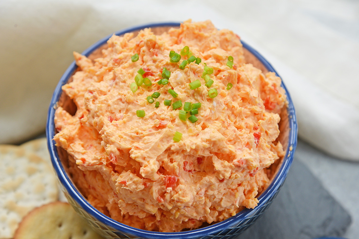 angled shot of bowl of pimento cheese spread