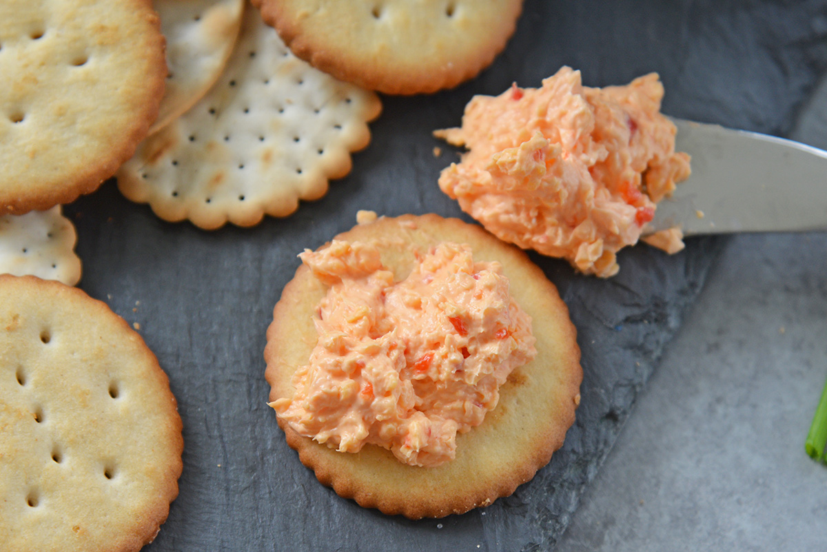 close up of pimento cheese on cracker