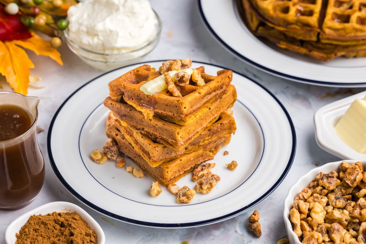 angled shot of stack of waffles on plate