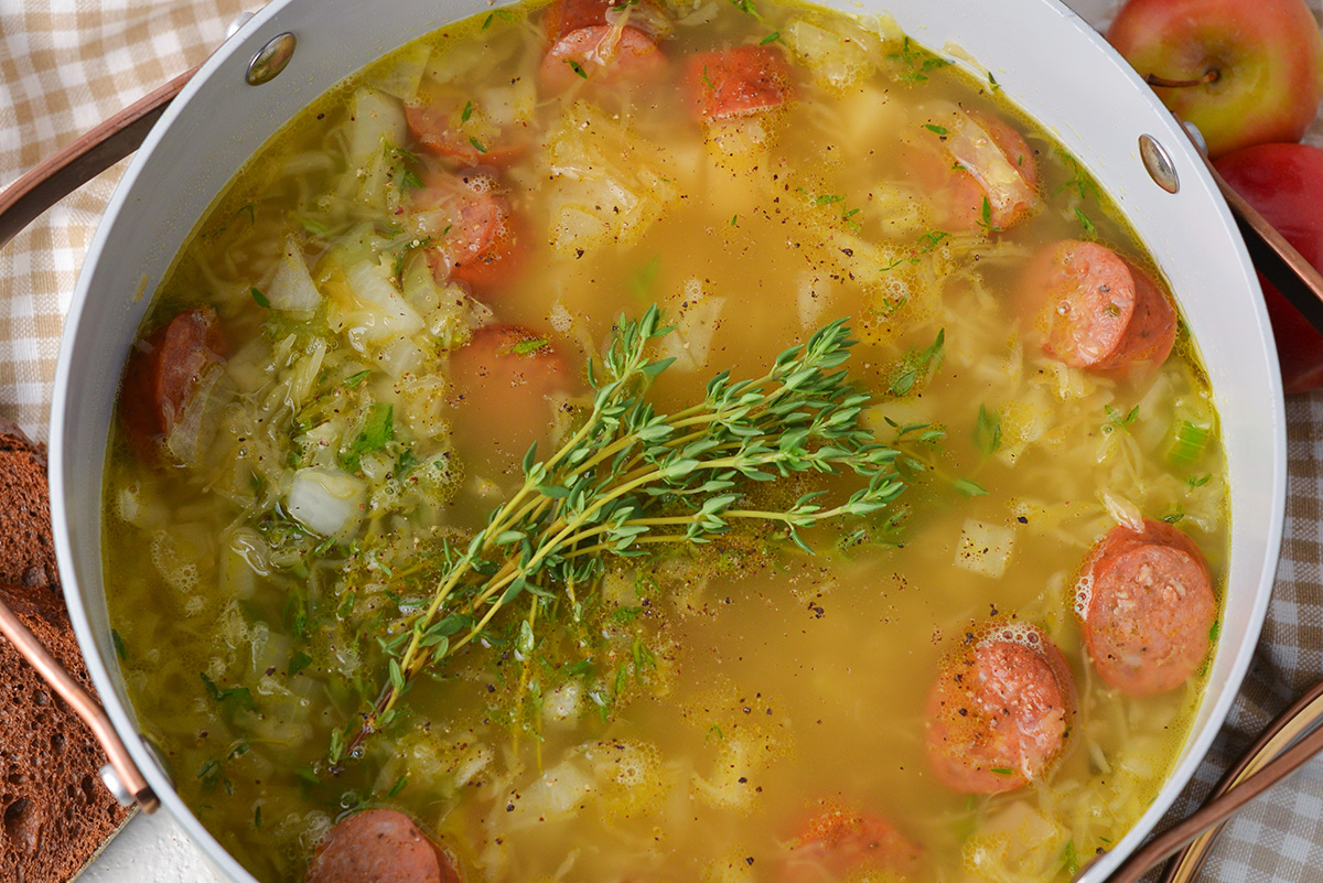 close up overhead shot of pot of sausage and sauerkraut soup