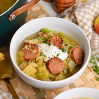 angled shot of bowl of sausage and sauerkraut soup