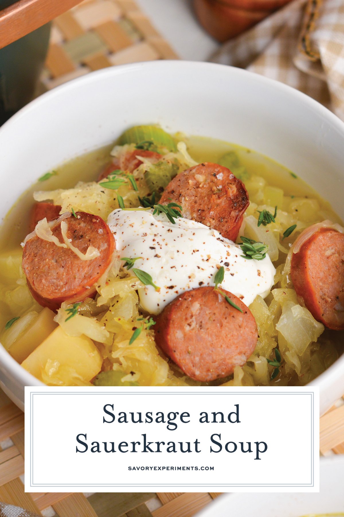 angled shot of bowl of sausage and sauerkraut soup with text overlay