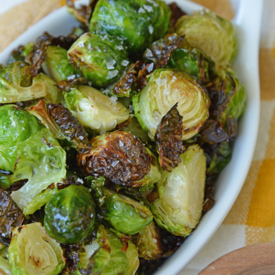 close up shot of air fryer brussels sprouts in serving dish