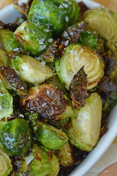 close up shot of air fryer brussels sprouts in serving dish