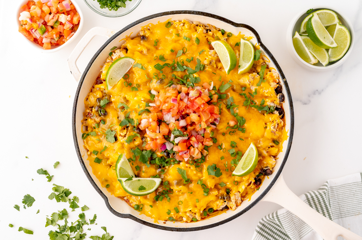 overhead shot of chicken enchilada casserole in skillet