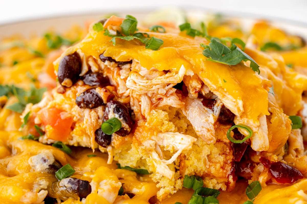 close up shot of slice of enchilada casserole