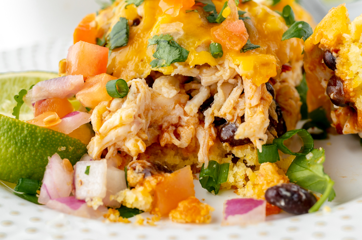 close up of chicken enchilada casserole on plate