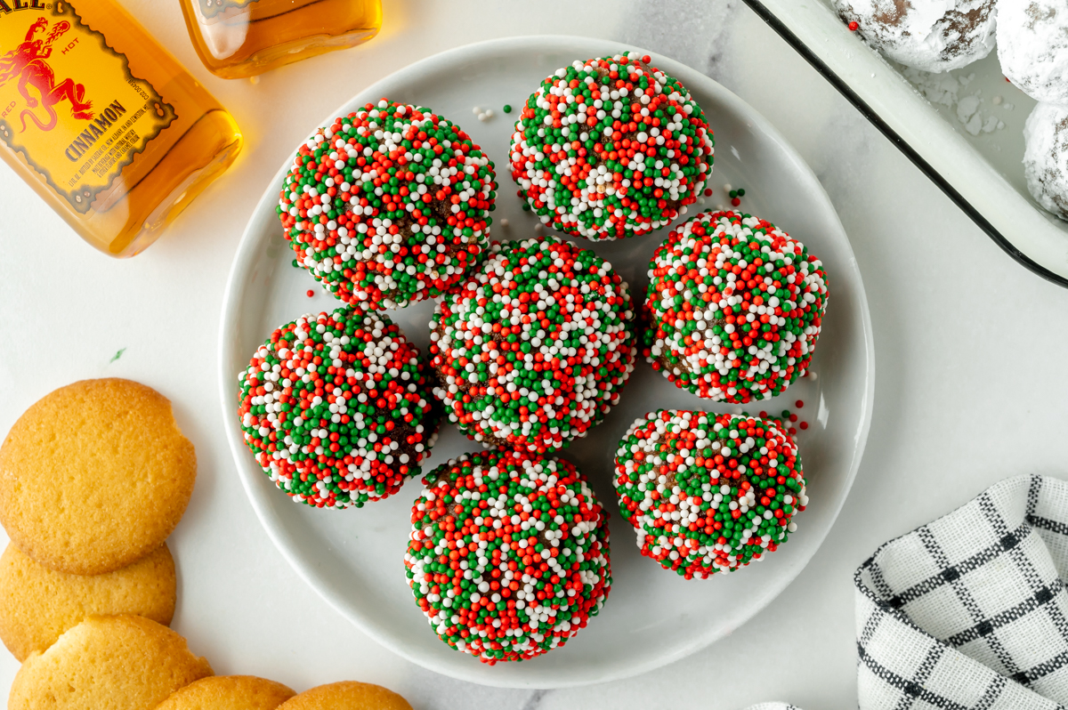 overhead shot of plate of sprinkle coated fireball chocolate truffles