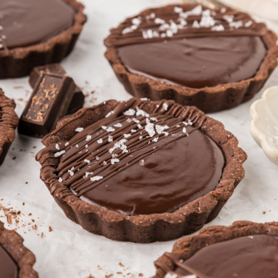 close up angled shot of chocolate tartlets