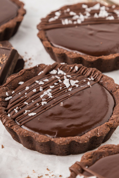 close up angled shot of chocolate tartlets