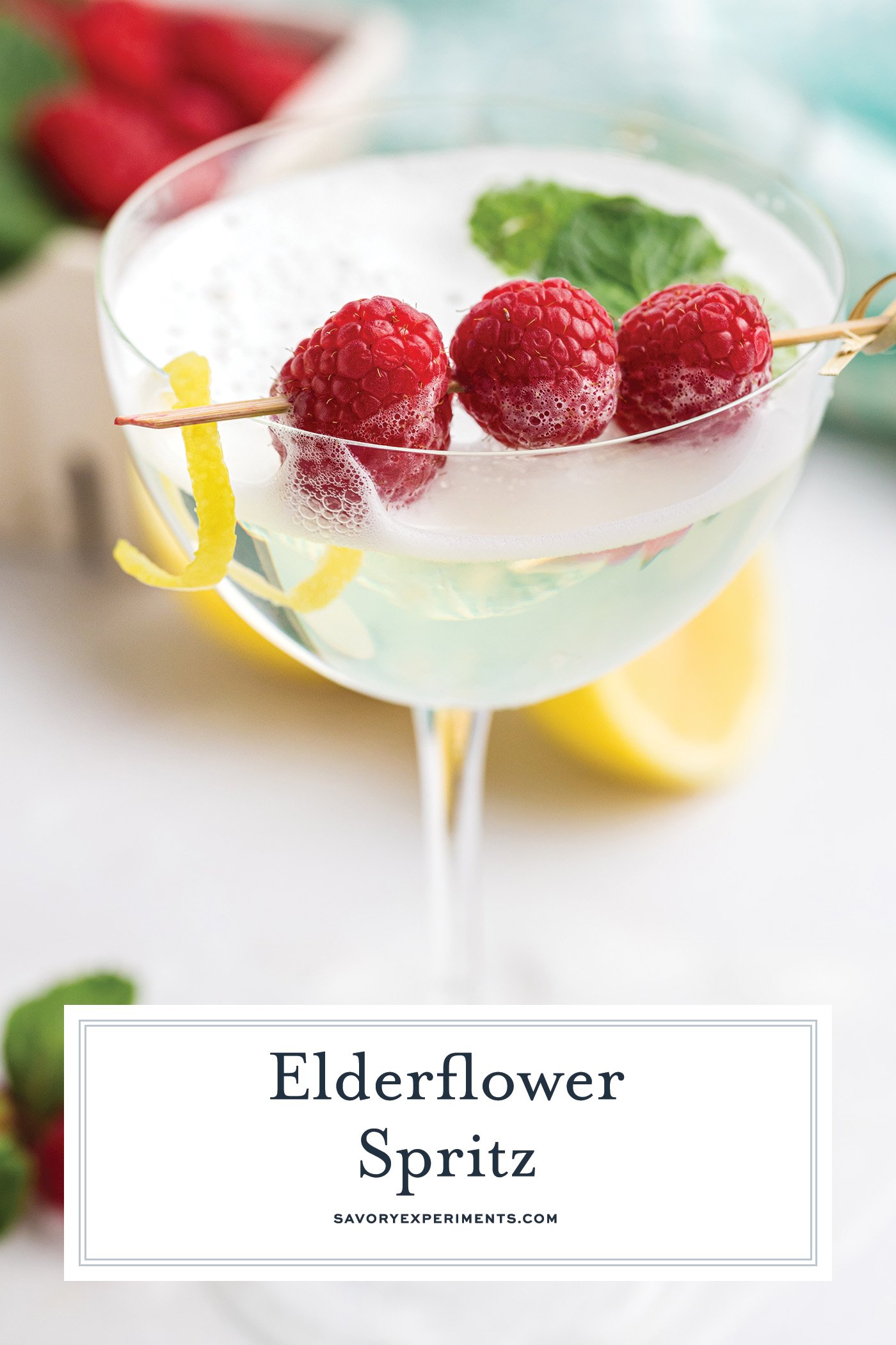 close up angled shot of elderflower spritz with text overlay