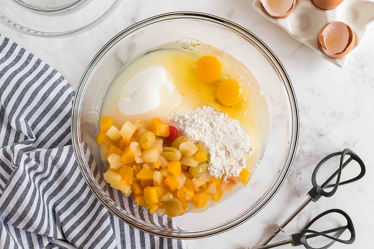 fruit cocktail cake ingredients in bowl