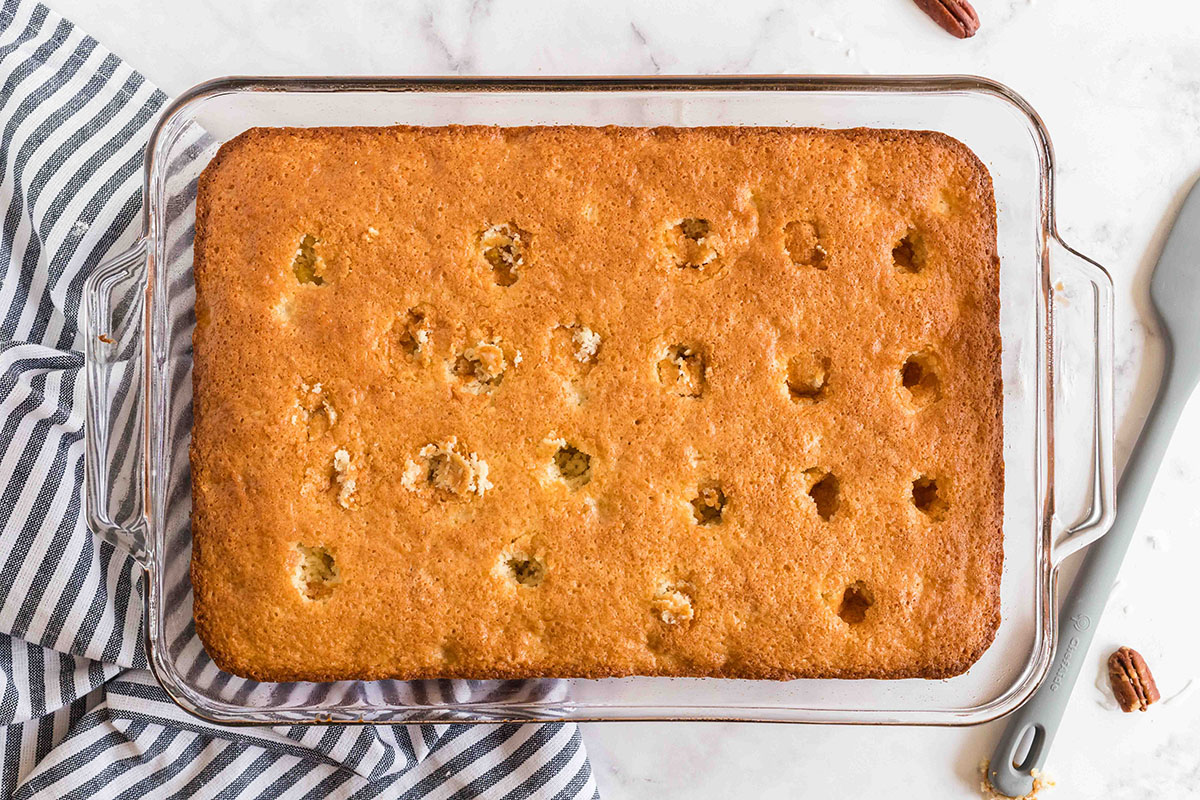 overhead shot of holes poked into cake