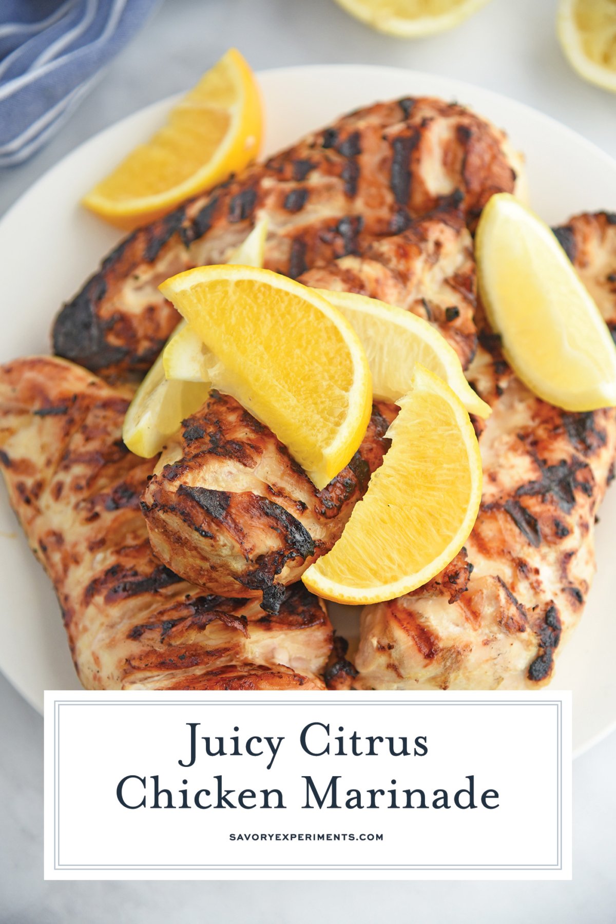 angled shot of of grilled citrus chicken on plate with text overlay