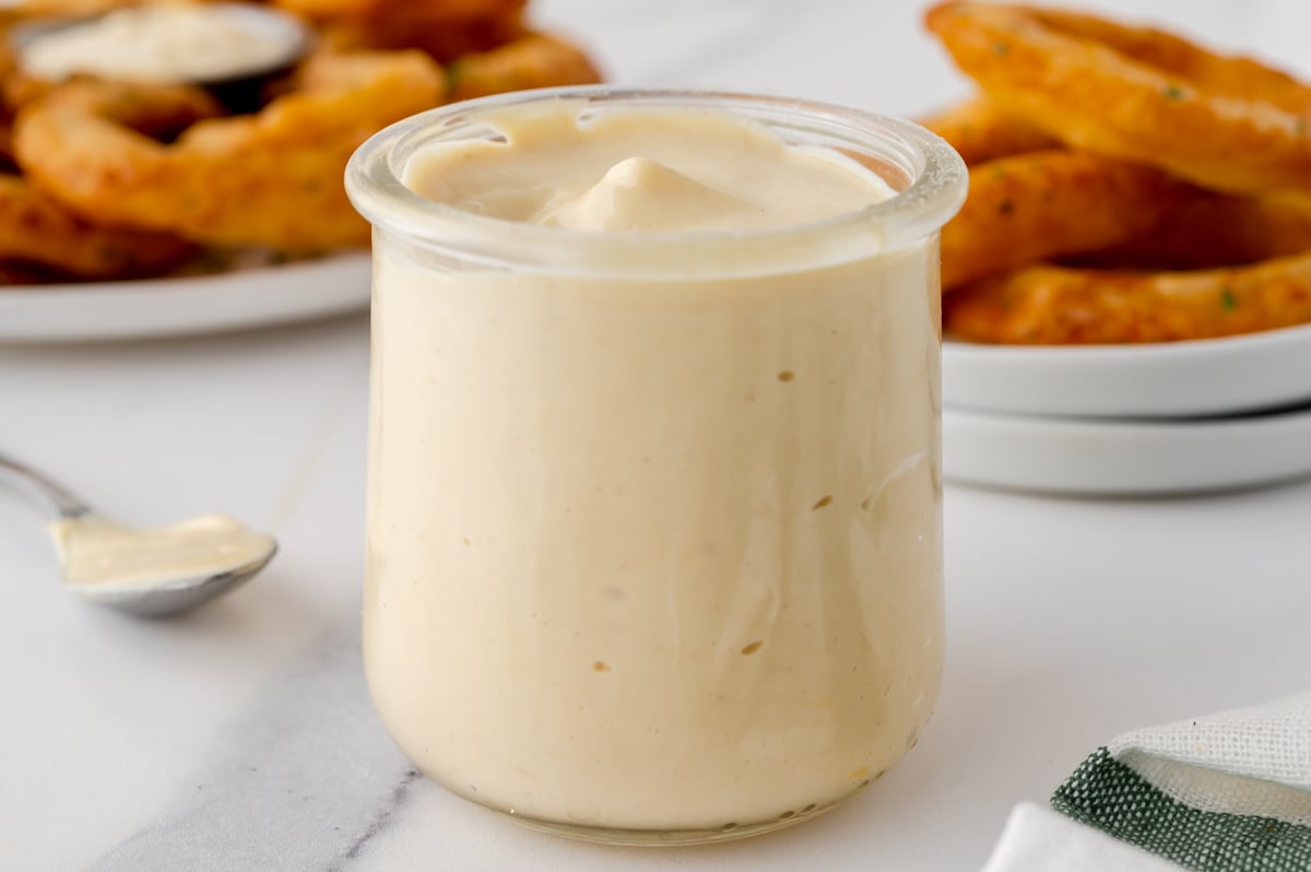 angled shot of jar of mustard aioli