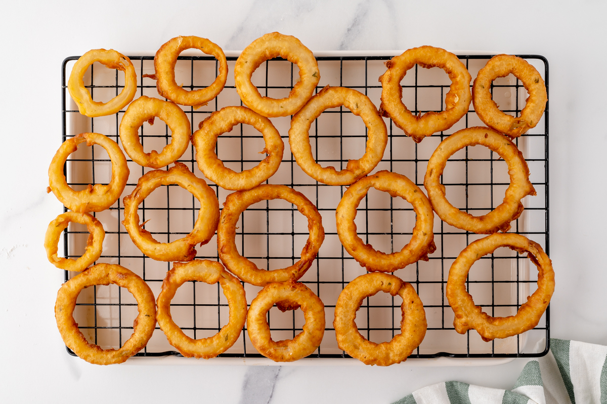 overhead shot of onion rings on wire rack