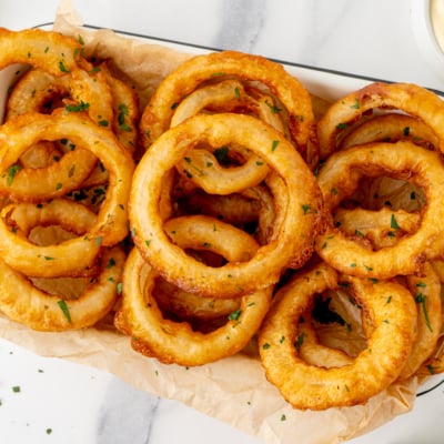 overhead shot of platter of beer battered onions rings