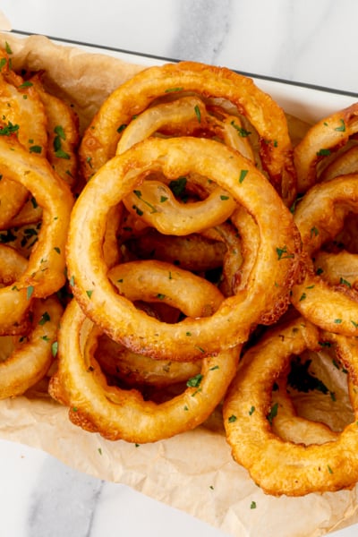 overhead shot of platter of beer battered onions rings